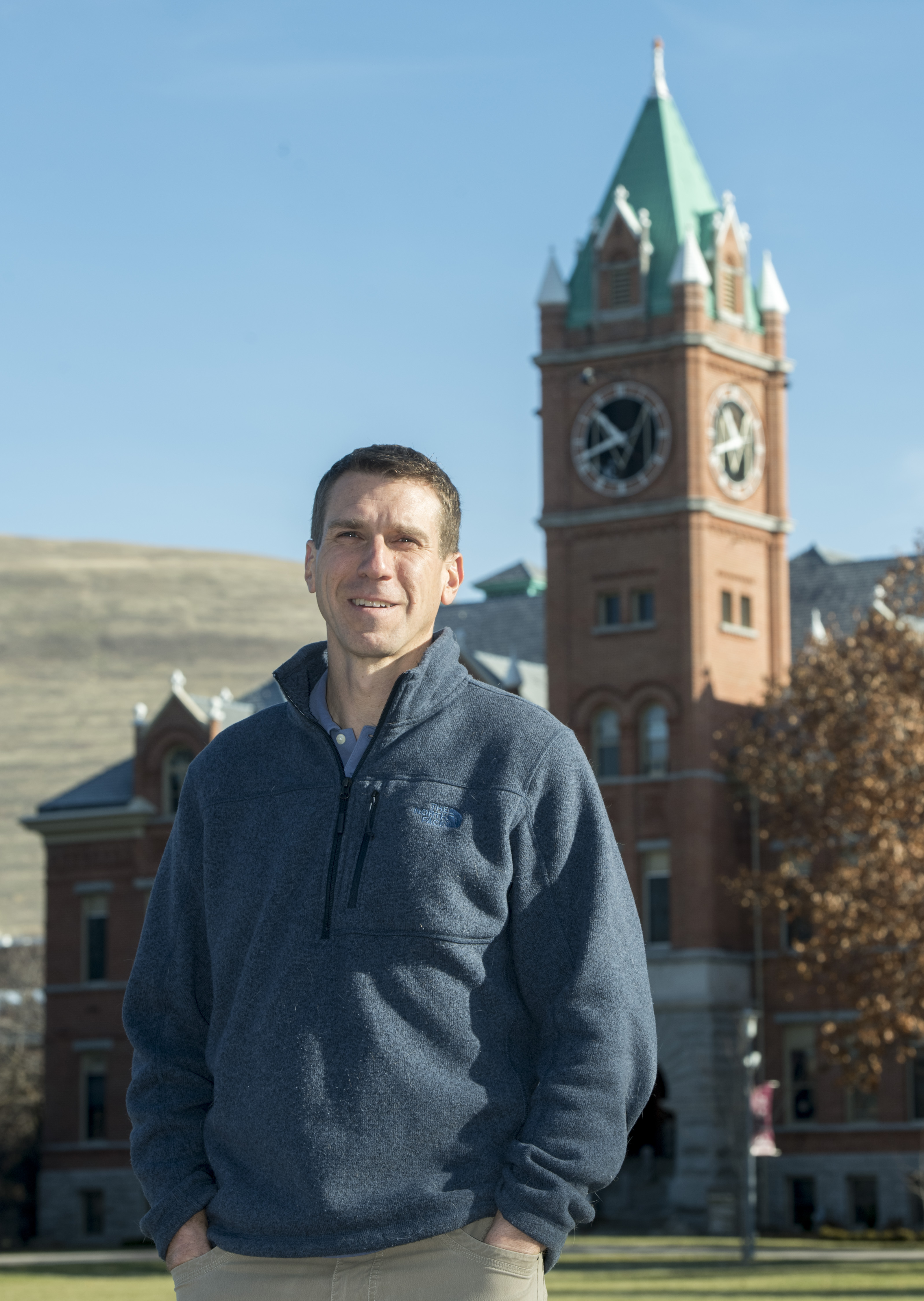 Travis looking serious in front of the UM clock tower